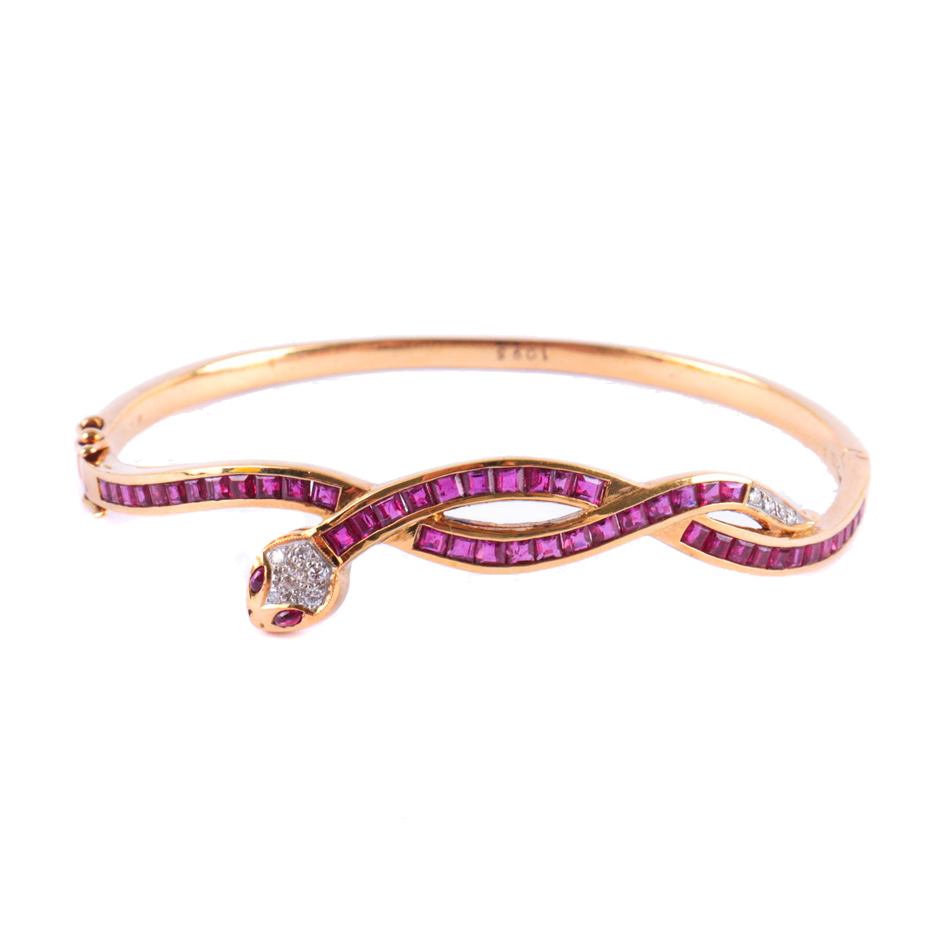 SNAKE-SHAPED BANGLE BRACELET WITH RUBIES AND DIAMONDS.