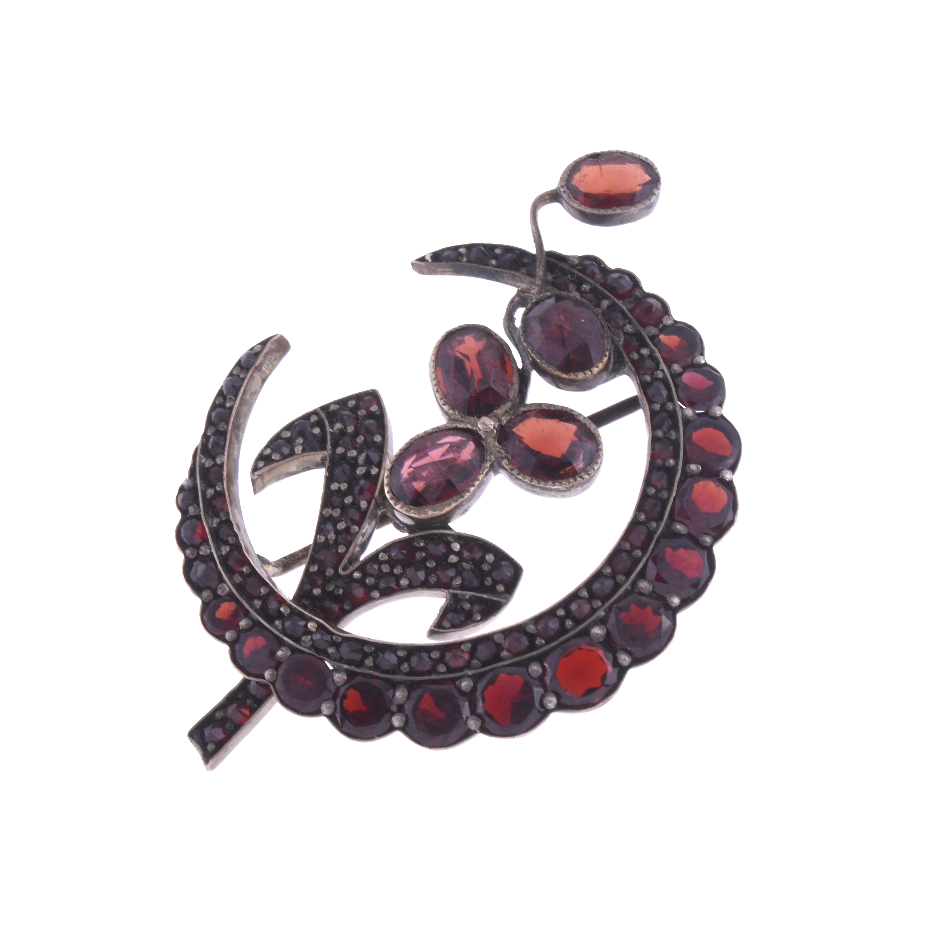 HALF-MOON BROOCH WITH GARNETS.