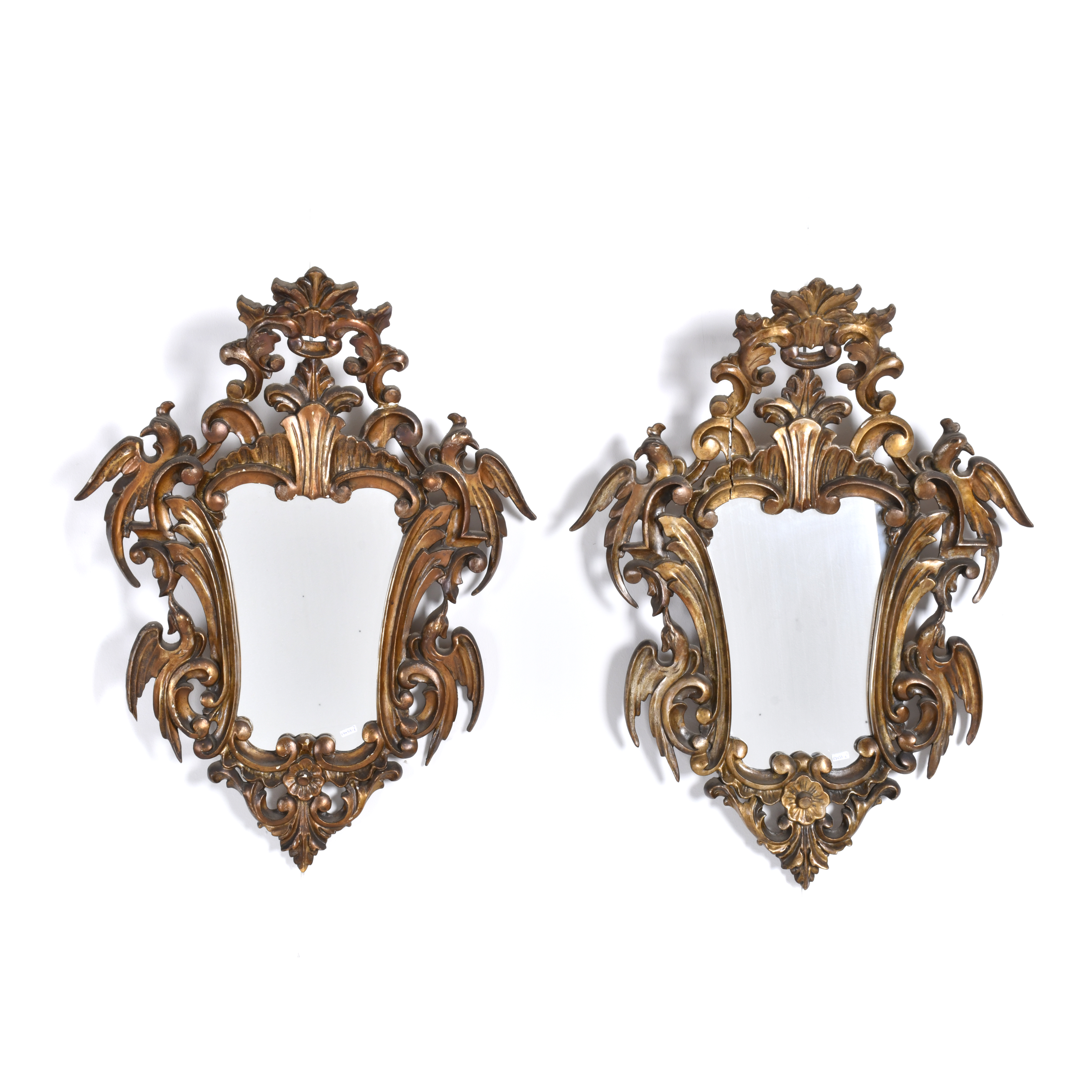 Pair of Elizabethan style ornamental mirrors, mid 20th cent