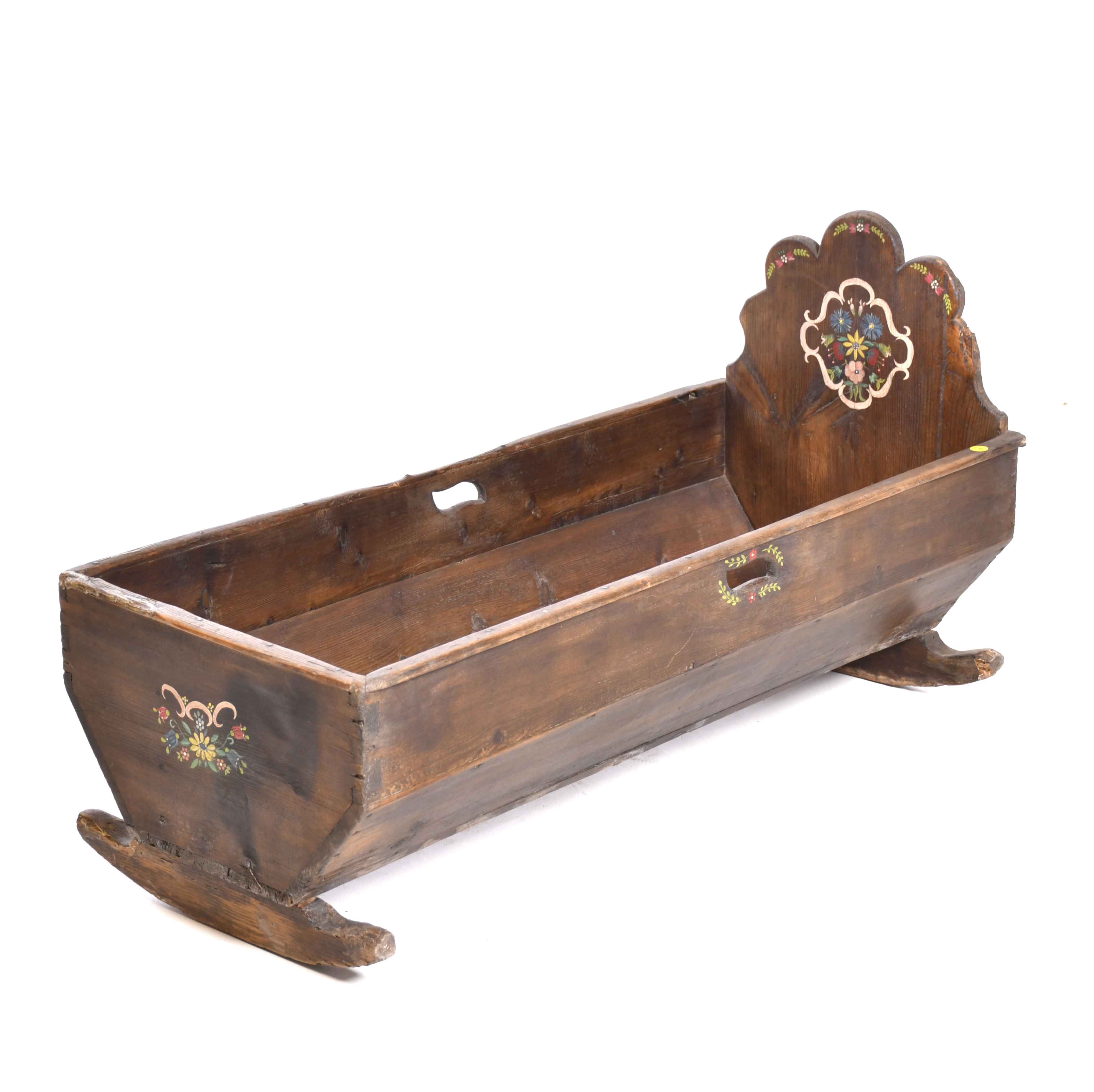 Polychrome wood cradle, 20th century.