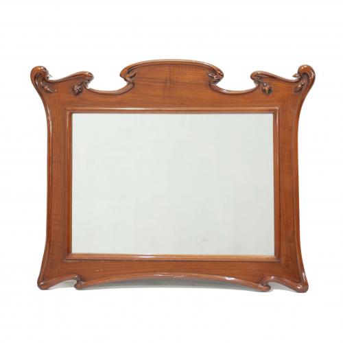 Carved wood frame decorated with floral motives. Small dent on the upper left corner. 77 x 99 cms 