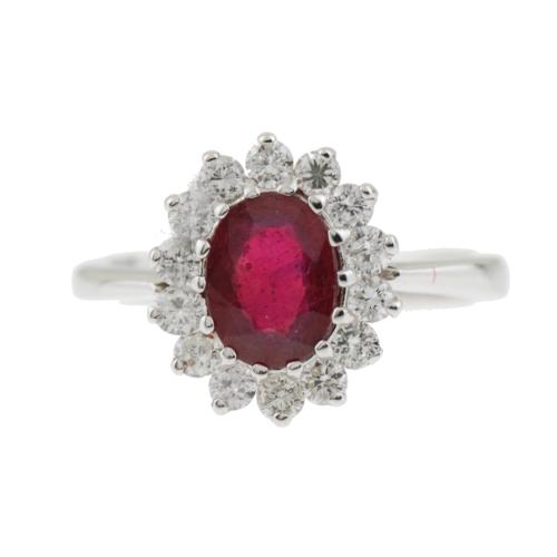 White gold, central oval-cut ruby of 1,55 ct., brilliant-cut diamonds of 0,63 ct.Ring size 17 mm.5,1 gr.