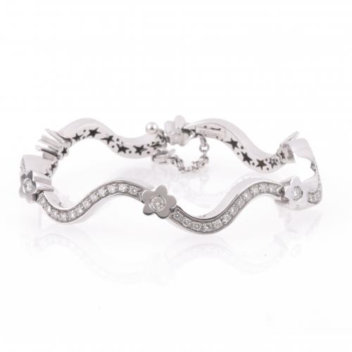 PULSERA ESCLAVA ONDULADA CON DIAMANTES.