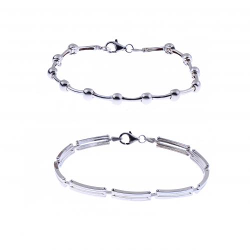 TWO SEMI-RIGID SILVER BRACELETS.