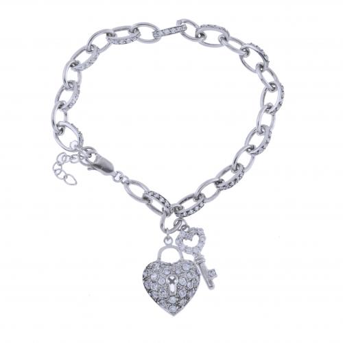 PULSERA CON LLAVE Y CORAZÓN DE CIRCONITAS.