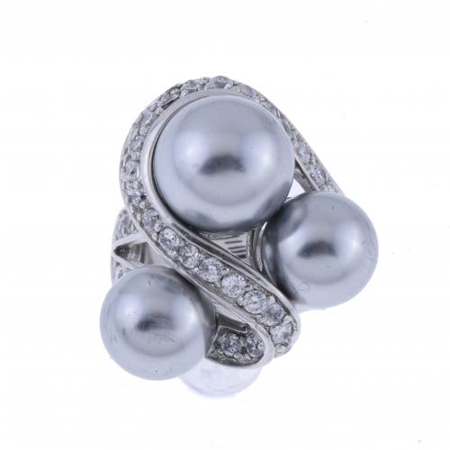 RING WITH PEARLS AND ZIRCONS.