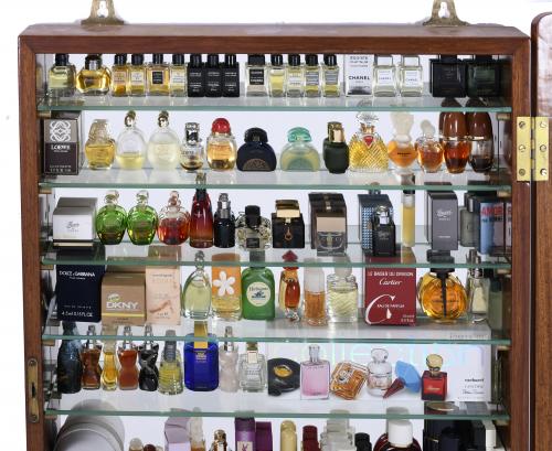 DISPLAY CABINET WITH A LARGE COLLECTION OF MINITURE PERFUME