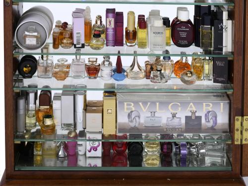 DISPLAY CABINET WITH A LARGE COLLECTION OF MINITURE PERFUME