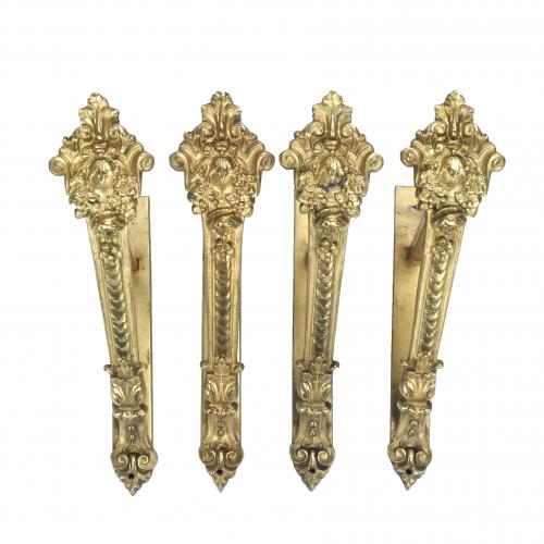 FOUR CURTAIN ROD BRACKETS, 20TH CENTURY.