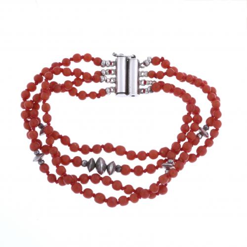 TWO BRACELETS AND A NECKLACE IN CORAL.