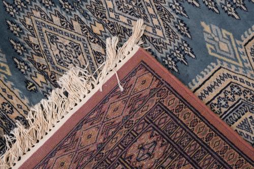 IRANIAN OCHRE AND BLUE CARPET, 20TH CENTURY. 