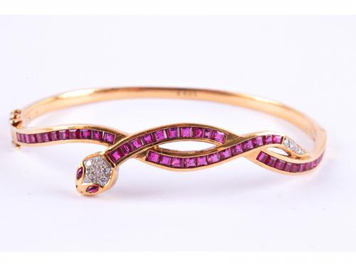 SNAKE-SHAPED BANGLE BRACELET WITH RUBIES AND DIAMONDS.