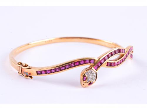 SNAKE-SHAPED BANGLE BRACELET WITH RUBIES AND DIAMONDS.