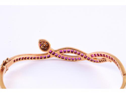 SNAKE-SHAPED BANGLE BRACELET WITH RUBIES AND DIAMONDS.