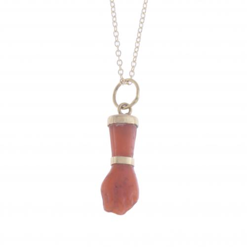 HAND-SHAPED CORAL PENDANT.