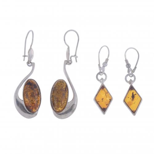 TWO EARRINGS WITH AMBER SIMILE.