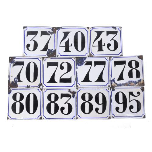 ELEVEN ENAMEL ESTATE NUMBERS.