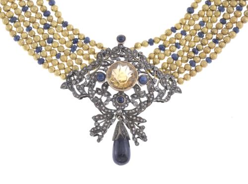 NECKLACE WITH SAPPHIRES AND LARGE SILVER CENTRE.