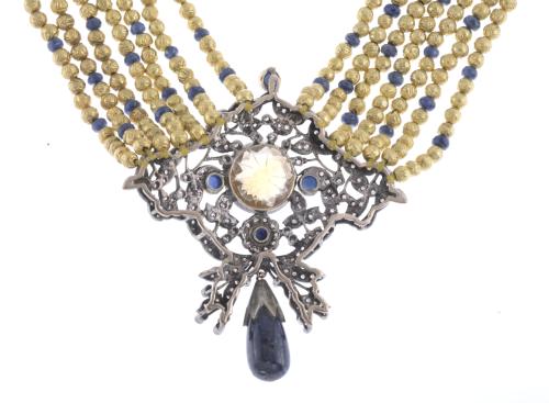 NECKLACE WITH SAPPHIRES AND LARGE SILVER CENTRE.