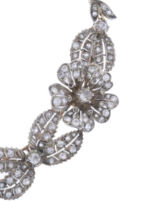 ATTR. TO MELLERIO, CIRCA 1905. TRANSFORMABLE FLORAL CHOKER.