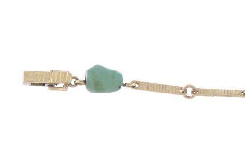 TURQUOISES AND GOLD BRACELET, CIRCA 1940.