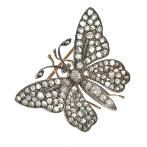  Broche en forma de mariposa con diamantes.