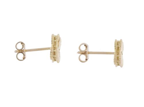 After VAN CLEEF models, &#39;Alhambra&#39; earrings.