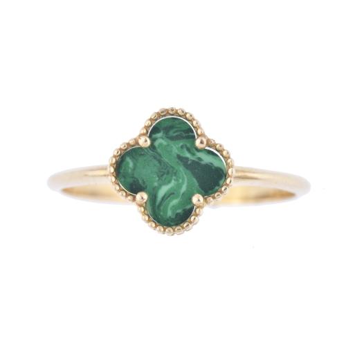 After VAN CLEEF models. &#39;Alhambra&#39; ring with malachite.