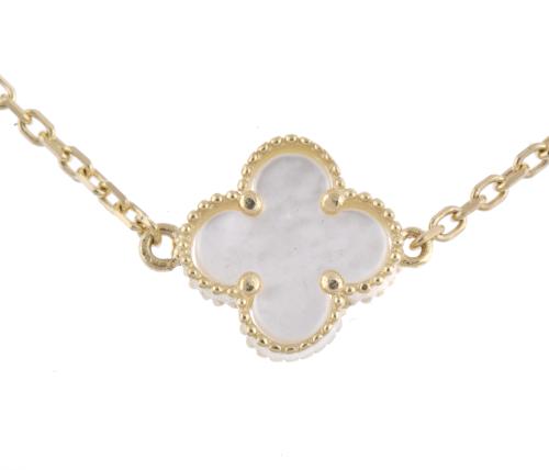 After VAN CLEEF models. &#39;Alhambra&#39; necklace with mother-of-