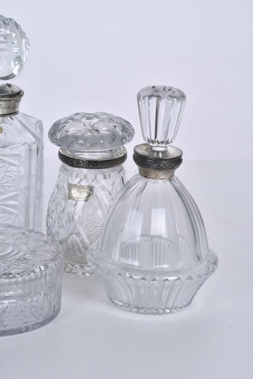 Set of five decanters and an ashtray, 20th century.