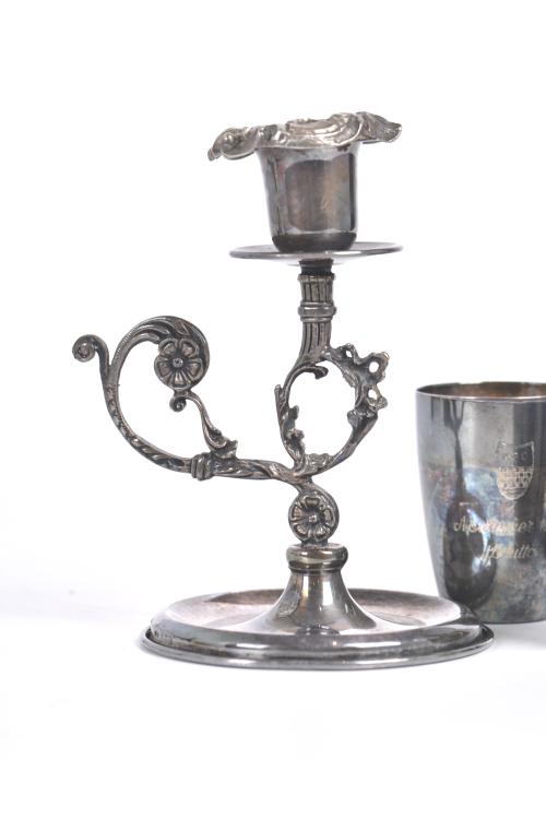 Set of five vessels and a candlestick in silver.