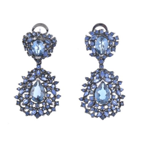 Fantasy earrings with blue topazes.