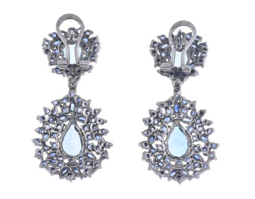 Fantasy earrings with blue topazes.