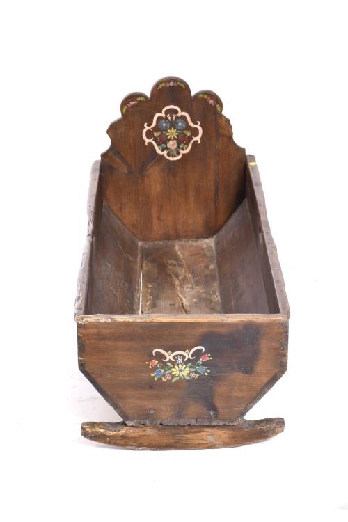 Polychrome wood cradle, 20th century.