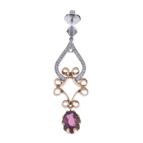 An earring with diamonds and ruby